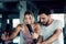 Portrait of Couple Love is Workout in Fitness Gym Together. Attractive Woman is Working Out Bike Cycling with Her Exercise Trainer