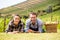 Portrait of couple lying down at vineyard