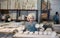 Portrait of craftswoman in a production workshop among ceramic cups and plates