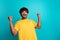 Portrait of crazy astonished person raise fists shout yeah success empty space isolated on turquoise color background