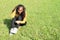 Portrait of crazy pretty girl sitting on grass