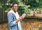 Portrait creative smiling african man reading book in autumn