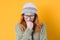 Portrait of crying sad depressed young woman, isolated on yellow background. Depressed lonely girl