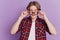 Portrait of curious amazed guy look empty space open mouth take off glasses on violet background