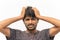 Portrait of curious or tense Young Indian male Cricket sports fan Painted Indian flag on his face