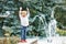 Portrait of cute adorable funny Caucasian little boy toddler in white shirt and blue jeans