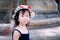 Portrait cute Asian girl turned her gaze to a sweet smile Wear a white polka dot hat.