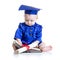 Portrait of cute baby in academic hat with book