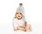 Portrait cute baby in grey knitted hat on white