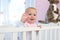 Portrait of a cute baby smiling and waving hello