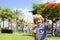 Portrait of a cute boy with candy on the background of a bright playground.