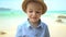 Portrait cute boy in a straw hat on the beach.