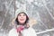 Portrait of cute boy in the woods under snow storm