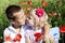 Portrait of cute brother and sister in poppy field