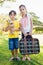 Portrait of cute brother and sister posing with old luggage and teddy bear