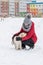 Portrait with cute fluffy puppy. Winter walk with dog. young woman walks with puppy, snowy winter