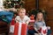 Portrait cute funny excited toddler baby boy with sister and mother open big white gift box christmas present against