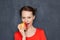 Portrait of cute girl biting ripe red apple with appetite