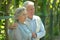 Portrait of cute happy cheerful retired couple outdoors