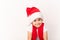 Portrait of cute happy smiling child in red Santa Claus hat isolated on white background. Beautiful five-year European boy. Banner