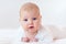 Portrait of cute infant baby on white, two months old