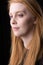 Portrait of a cute Irish redhead female. Closeup of head and face.