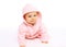 Portrait cute little baby crawls in the pink bathrobe