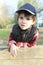 Portrait of cute little boy (3 years) outdoors