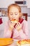 Portrait of cute little child girl with pizza. Happy child having fun eating dinner