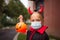 Portrait of cute Little Girl in costume of evil at home. Happy Halloween during coronavirus covid-19 pandemic quarantine concept.