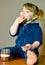 Portrait of a cute little girl eating spread with fingers