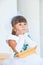 Portrait of a cute little girl in a magnificent white and blue dress