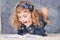 Portrait of cute little girl reading book while lying on floor