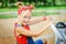 Portrait of a cute little girl in a red bandana. child playing on the playground