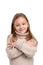Portrait of cute little kid in stylish knitted sweater looking at camera and smiling