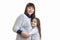 Portrait of a cute moms and daughters who stand in the Studio and are hugging isolated on a white background