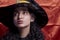 Portrait of a cute multi-racial woman in witch cap