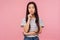 Portrait of cute pensive girl with long hair in striped t-shirt pondering decision, looking confused uncertain