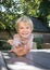 Portrait of cute positive friendly laughing boy 5 years old outdoors