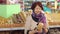 Portrait of a cute retired woman in a grocery store in the bread Department.