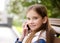 Portrait of cute smiling  little girl child calling by cell phone smartphone