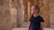 Portrait Cute teenager girl looking away on background stony walls