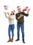 Portrait of cute young couple catching Christmas presents on white background