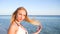 Portrait of cute young female, beautiful girl on shore of sea