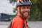 Portrait of a cyclist with helmet and smiling