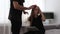 Portrait of dad help her daughter to comb her hair at home