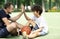 Portrait of dad and son giving high five playing basketball