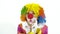 Portrait of dancing clown against white background