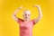 Portrait of dancing mature woman on color background