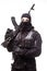 Portrait of dangerous bandit in black wearing balaclava and holding gun in hand